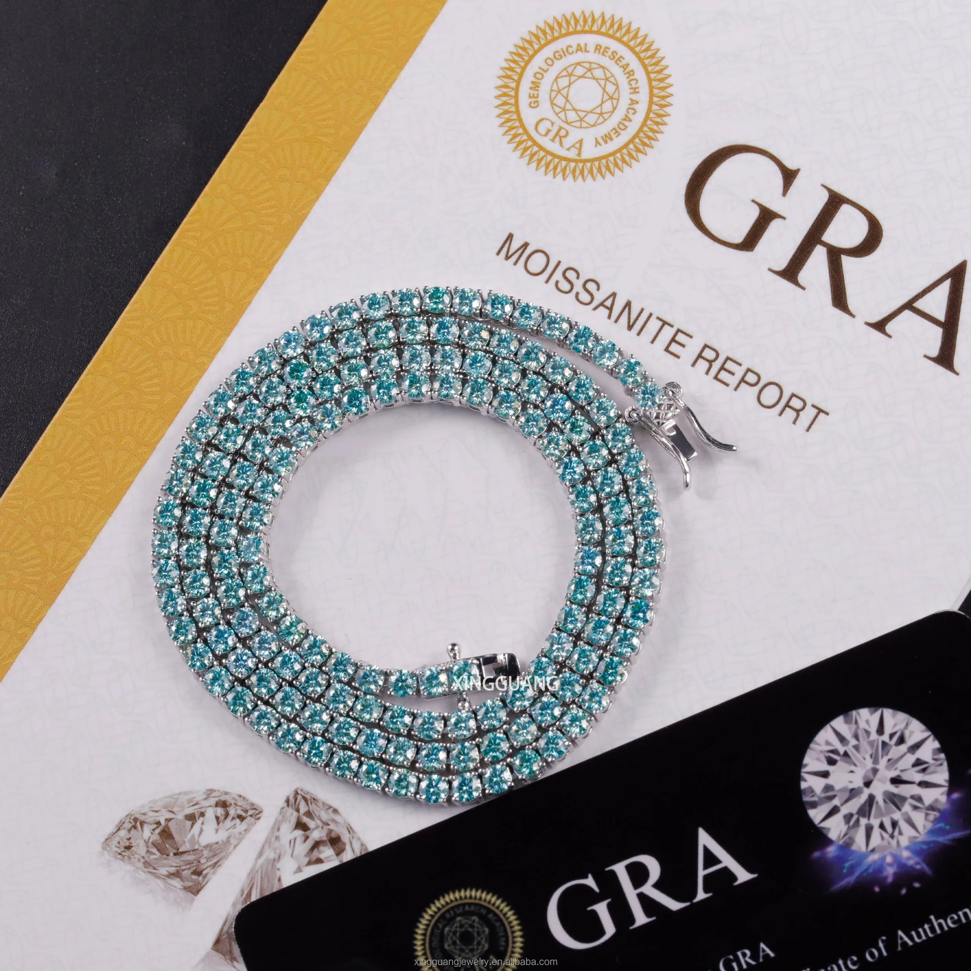 Moissanite tennis chain necklace in sparkling green blue colors on GRA report background.